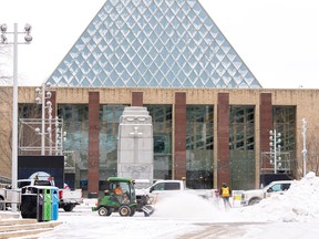Crews clear snow in front of city hall after Edmonton received a dump of snow overnight and into the morning on Monday, Feb. 5, 2024.