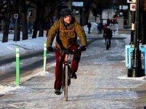 A cyclist heads down a bike lane near 88 Avenue and 109 Street in Edmonton on Feb. 10, 2023.