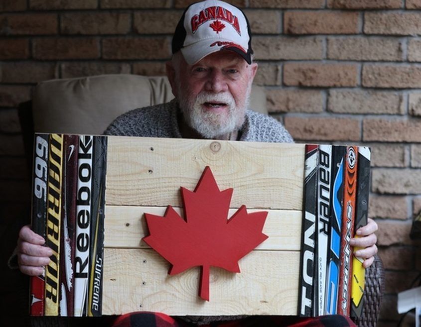 Don Cherry shows off some hockey art, given to him by artist Jamie Wiley, at his home on Tuesday, May 6, 2025.