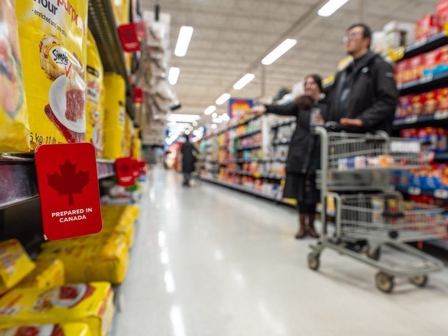 Customers grocery shopping in an aisle at the Real Canadian Superstore in Toronto, March 3, 2025