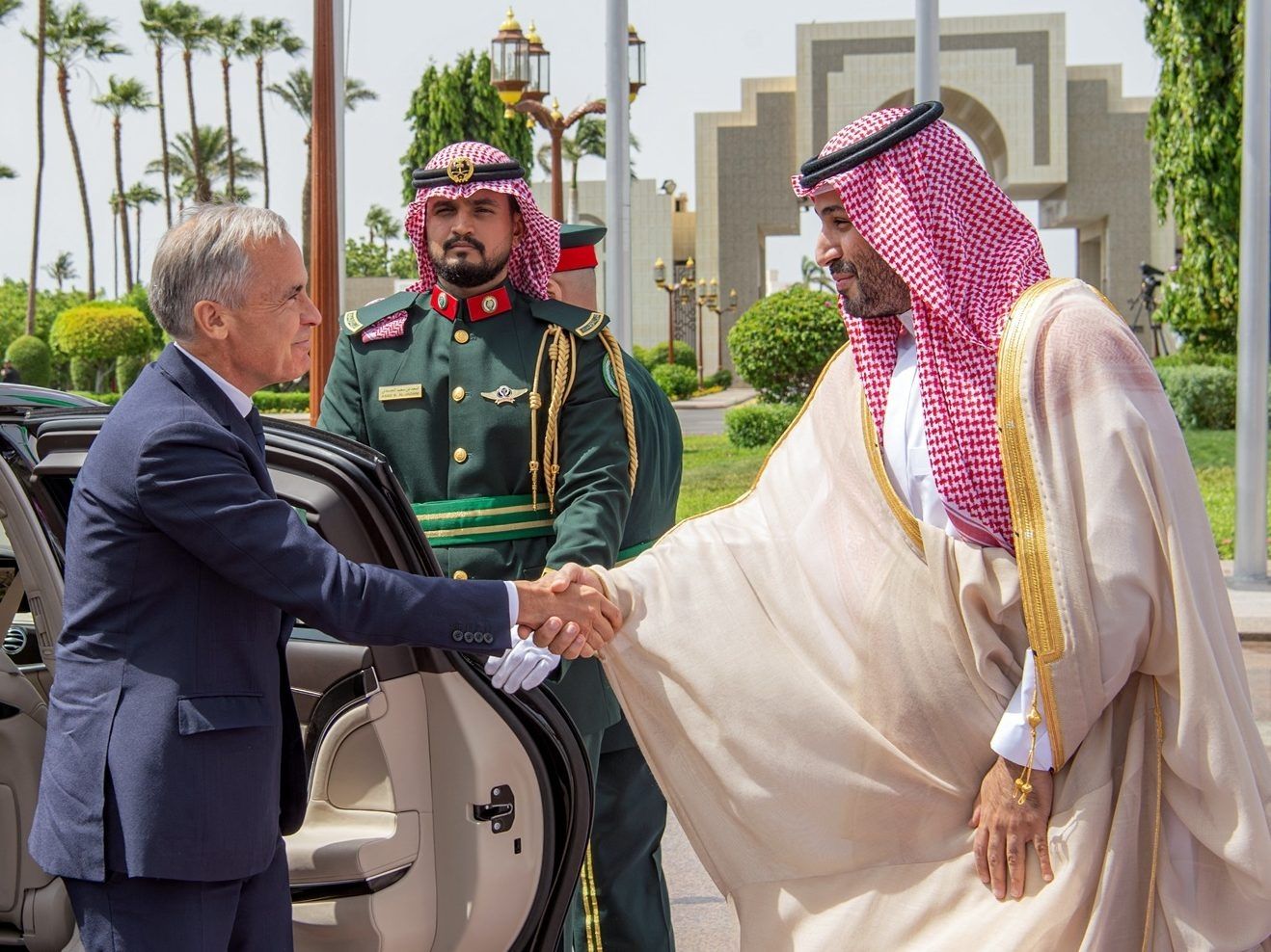 This handout picture released by the Saudi Ministry of Media shows Saudi Arabia's Crown Prince Mohammed bin Salman (R) welcoming Prime Minister Mark Carney during his official visit at Al-Salam Royal Palace in Jeddah, Saudi Arabia, on Thursday, July 9, 2026.