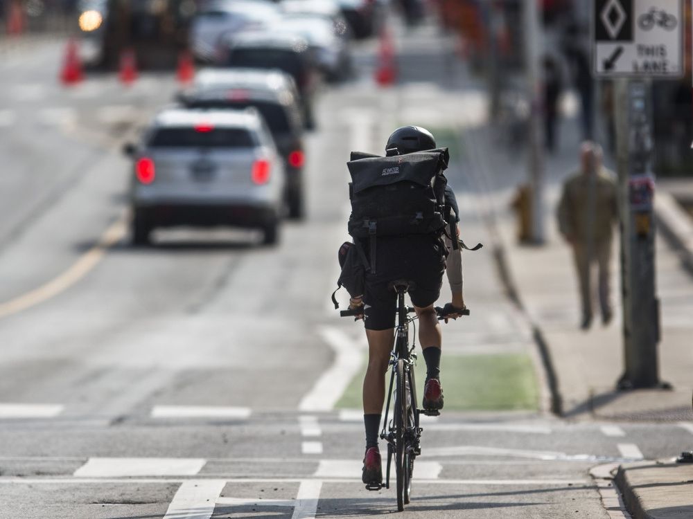 A cyclist in the bike lane along Bloor St. W., near Christie St. in Toronto, Ont. on Thursday May 9, 2019.