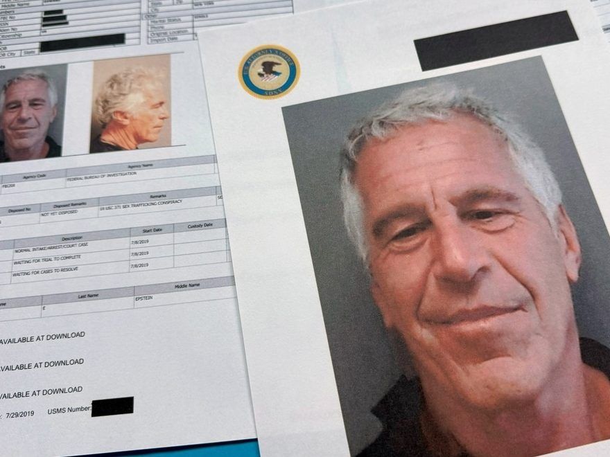 Documents that were included in the U.S. Department of Justice release of the Jeffrey Epstein files are photographed Friday, Jan. 2, 2026.