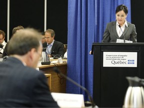 Suzanne Cote (R) questions Marc Bellemare during the Bastarche Commission hearings. Photo: Jacques Boissinot