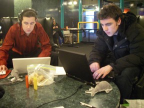 Colin Noga (left) and Aaron Lindsay (right) hard at work building their 'rhythm-based' smartphone video game as the Great Canadian Appathon gets underway in Waterloo