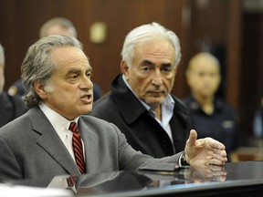 IMF chief Dominique Strauss-Kahn (r) appears with his lawyer, Benjamin Brafman, appeared in court on Monday for the first time since he was pulled off a plane May 14 in New York and accused of trying to rape a hotel maid.
