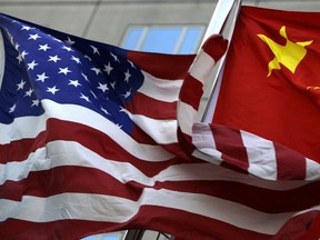 National flags of the U.S. and China.