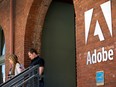 People exit the Adobe Systems Inc. office in San Francisco, California