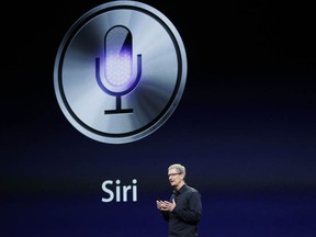 CEO Tim Cook talks about Siri during an Apple event in San Francisco