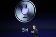 CEO Tim Cook talks about Siri during an Apple event in San Francisco