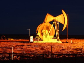 An oil pump jack stands outside of Watford City, North Dakota.