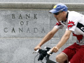 The Bank of Canada left interest rates unchanged on Tuesday, but made clear it was still weighing an eventual move higher, even as other central banks ease monetary policy to cope with damaging economic slowdowns.