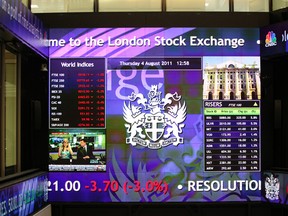 The latest financial information is displayed on screens inside the atrium of the London Stock Exchange Group Plc in London, U.K.