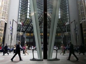 Pedestrians on Bay Street in the heart of Toronto's financial district.