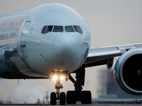 An Air Canada plane taxi's across the runway at Pearson International Airport in Toronto.