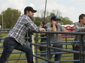 Matt Damon, right, on the set of the film Promised Land.