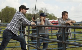 Matt Damon, right, on the set of the film Promised Land.