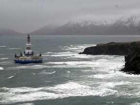 This image provided by the U.S. Coast Guard shows the Royal Dutch Shell drilling rig Kulluk aground off a small island near Kodiak Island Wednesday Jan. 2, 2013. There's no indication of a fuel leak from Kulluk, the Coast Guard said Wednesday night, Jan. 2, 2013, of a maritime accident that has refueled debate over oil exploration in the U.S. Arctic Ocean.