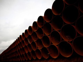 Pipe is stacked at the southern site of the Keystone XL pipeline on in Cushing, Oklahoma. Within the next 25 years, just under a million people will hold oil sands related jobs, up from 75,000 two years ago, and 126,000 of the total will be held by people outside of Alberta, according to a 2012 Conference Board of Canada report.