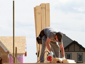 Construction workers build homes in Calgary. Alberta has eased its entry requirements for out-of-province apprentices allowing them to continue their apprenticeships from where they left off in their home provinces.