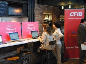 Entrepreneurs register their businesses on the new Shopsmallbiz.ca directory at a launch event in Toronto on Thursday.