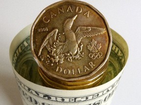 The Canadian dollar wallowed at four-year lows today after the Bank of Canada all but begged the market to sell the currency.