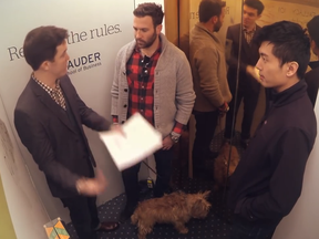 Assistant consumer marketing professor, David Hardisty (left), offers unsuspecting elevator riders a lecture on the planning fallacy in this still frame from a video that serves as but one component of the Sauder School of Business's new international branding campaign.