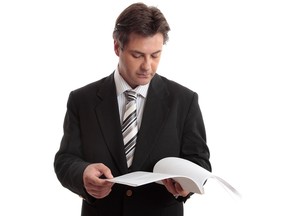 Businessman reading report or document