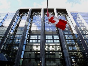 The Canadian flag flies outside the Bank of Canada building in Ottawa