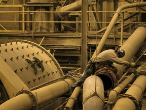 A mining technician refits a slurry pipe at Newmont Mining Corp's Carlin/Gold Quarry operations, in Eureka County, Nevada