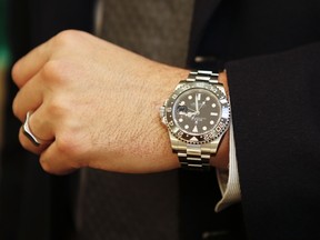 A Rolex watch is seen inside a Rolex store.