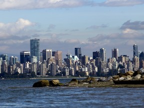 The Vancouver skyline is pictured from Spanish Banks near the University of British Columbia in Vancouver, British Columbia, Canada, on Thursday, October 3, 2013. Photographer: Ben Nelms/Bloomberg