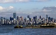 The Vancouver skyline is pictured from Spanish Banks near the University of British Columbia in Vancouver, British Columbia, Canada, on Thursday, October 3, 2013. Photographer: Ben Nelms/Bloomberg