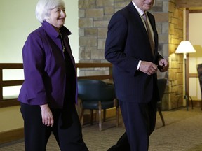 Federal Reserve Chair Janet Yellen, left, and European Central Bank President Mario Draghi walk together during the Jackson Hole Economic Policy Symposium at the Jackson Lake Lodge in Grand Teton National Park near Jackson, Wyo. in August 2014