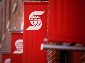 The logo of Bank of Nova Scotia, also known as Scotiabank, is displayed on banners outside a branch in Vancouver.