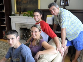 Monica Di Franco poses with her sons Lucas, left,  Lawrence, 19, and husband Joe, at their Etobicoke home.  Lawrence was the recipient of a Heritage RESP fund Monica set up years ago.
