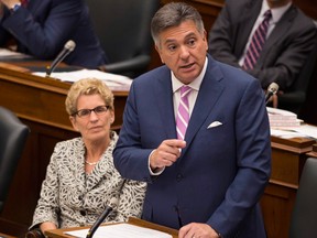 Ontario Finance Minister Charles Sousa, next to Premier Kathleen Wynne at Queen's Park