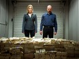 Skyler White, played by Anna Gunn, left, looking over a stash of money with her husband Walter White, played by Bryan Cranston, in season five of "Breaking Bad."