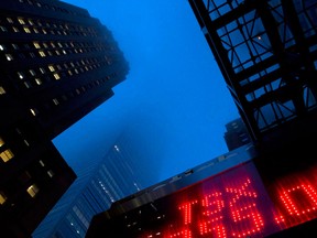 Financial stocks weighed on the S&P/TSX Composite on Tuesday following an announcement that the cost of mortgage insurance would increase for Canadian homebuyers.