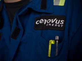 A Cenovus Energy Inc. logo is displayed on an employee's uniform