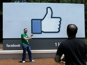 Signage is displayed outside Facebook headquarters in Menlo Park, California