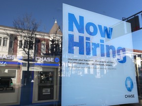 Hiring sign in bank window