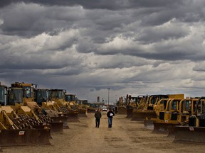 Buyers look over machinery at the Ritchie Brothers auction in Nisku Alberta