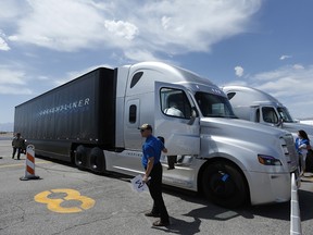 People load in to a Daimler Freightliner Inspiration self-driving truck for a demonstration Wednesday, May 6, 2015, in Las Vegas. Although much attention has been paid to autonomous vehicles being developed by Google and traditional car companies.