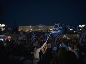 Hundreds of 'No' voters celebrate Syntagma square in front of theparliament on July 5, 2015 in Athens after early results showed those who rejected further austerity measures in a crucial bailout referendum were poised to win. Greek voters headed to the polls July 5 to vote in a historic, tightly-fought referendum on whether to accept worsening austerity measures in exchange for more bailout funds, in a gamble that could see the country crash out of the euro.FP PHOTO /ARIS MESSINISARIS MESSINIS/AFP/Getty Images