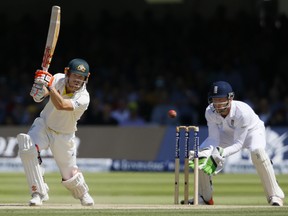 Australia's David Warner plays a shot off the bowling of England's Moeen Ali on the fourth day of the second Ashes Test match between England and Australia, at Lord's cricket ground in London, Sunday, July 19, 2015. (AP Photo/Kirsty Wigglesworth)