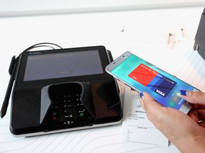 Guests demo Samsung Pay, a mobile payment service, in New York City.