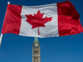 The Canadian flag flies over the Peace Tower on Parliament Hill.
