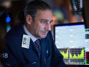 A trader works on the floor of the New York Stock Exchange.