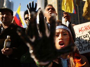 Demonstrators protest against Chevron in an contentious dispute with Ecuador.